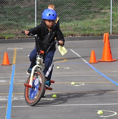 A child doing cycle training